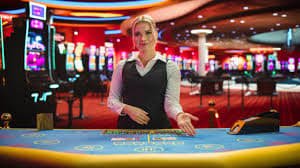 Live dealer table with professional croupier and multi-camera broadcast setup
